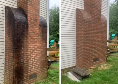 Side-by-side of a chimney: left side is stained with soot, right side is cleaned and restored.