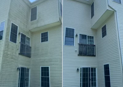 Split view of a house exterior before and after cleaning; left is dirty, right is freshly washed and clean.