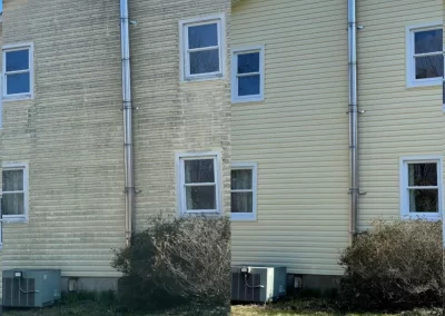 Side-by-side of a house before and after cleaning, showing dirty vs. clean yellow siding.