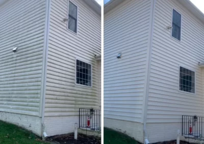 Side-by-side comparison of a house exterior before and after cleaning, showing dirty vs. clean siding.